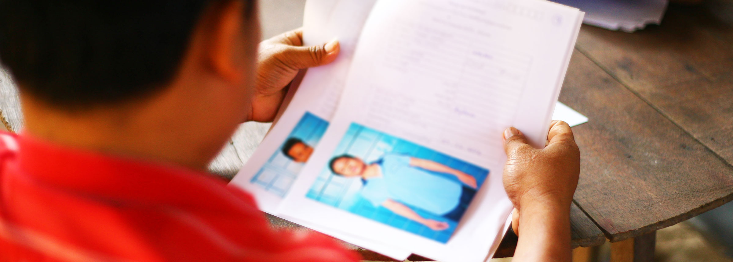 Anti-trafficking officer looking through ID documents